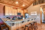 Alpine Escape - Kitchen with Breakfast Bar and stainless Steel appliances. 